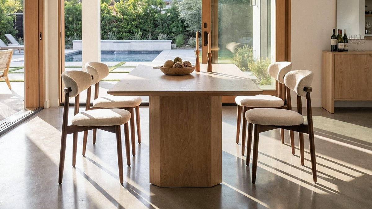 upholstered dining chairs around a wooden dining table